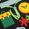 Snap pockets, clock, laces, and clock that teach practical life skills inside of a Montessori toy.
