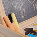 Close up of Montessori Magnetic Circus board showing colorful chalk leaning on the board. 