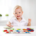 Boy playing with Montessori ABC Matching Cards. 