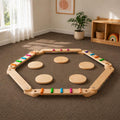 Wooden and colorful Montessori Balance Beams and stones assembled in a child's playroom.