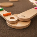Close up on a joint pieces of the Montessori Balance Beams and Stones set for kids.