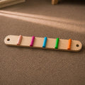 Montessori Balance Beam with colorful beads. 