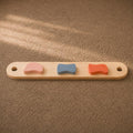 Balance beam with colorful shapes that help children practice movement.