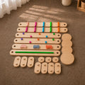All parts and pieces of the Montessori Balance Beams and Stones set.