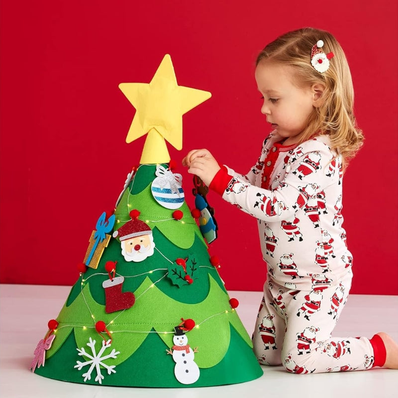 Little girl decorating her 3d Christmas Tree. 