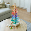 Cute Montessori Rainbow Tree wooden toy with colorful leaves and marbles.