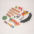 All parts of the Montessori Crane & Train Magnetic Playset, featuring a train, passenger car, crane, ramps, helicopter, tracks, helipad, people, and crates. 
