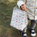 Little boy holding a cute picnic bag. 