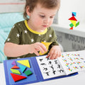 Little boy playing with the Montessori Magnetic Tangram Book