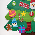 Different colorful ornaments attached to the 2D felt Christmas tree.
