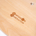 Montessori Generation Logo engraved on the back of the Montessori Penguin's Clock 2.0