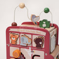 Close up on interactive activities featured on the Montessori Smart Safari Bus such is a sliding hummingbird, safari animals, wooden maze, and beads.