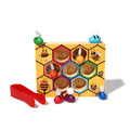 Montessori wooden toys that consists of a board and little wooden bees for children.