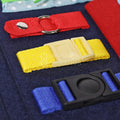 Red, yellow, and blue buckles inside of the felt Montessori Busy Board.