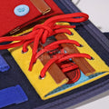 Closeup of the shoelaces that come with the Montessori Busy Board.