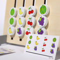 Close up of the cards and pieces with fruit on them of the Montessori Double-Sided Matching Game.