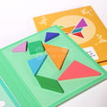 Close-up of the yellow and green Tangram Book with wooden pieces of different colors.