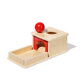 Montessori wooden toy with a ball on it that toddlers can use to help motor skills.