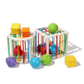 Cube and cylinder shaped boxes with differently colored shapes for children's fine motor skills.