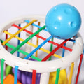 A blue ball sitting on top of the Montessori Shape Blocks.