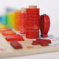 Closeup of red rings and fish in the Montessori Smart Board set.
