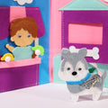 Closeup of a dog and a boy that are inside of the interactive Montessori Story Book.