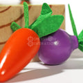A carrot and a beetroot wooden toys that come with a Montessori Vegetable Set.