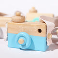 Close-up of the blue variant of the Wooden Camera made for toddlers.