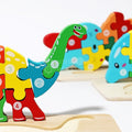 Close-up of the smiling face of the dino-shaped wooden puzzle.