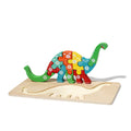 The version of the wooden puzzle in a shape of a dino standing upright on a wooden board.
