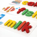 Closeup of the Montessori spelling card with the word milk written on it.